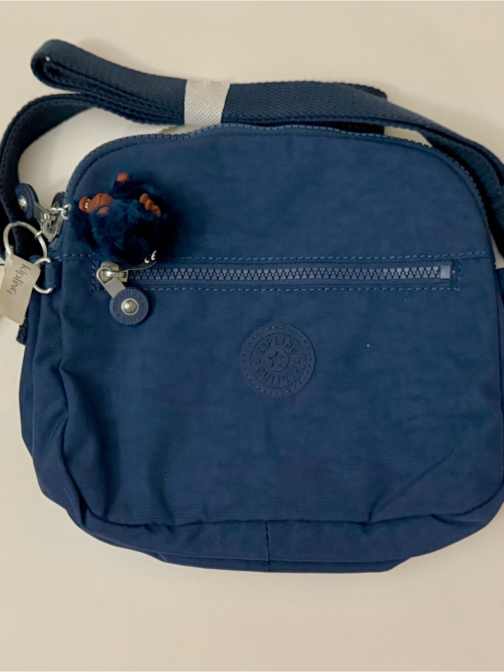 Kipling Dark Blue Crossbody Bag with Pom Pom Charm